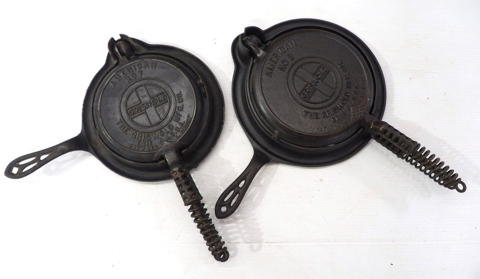 (2) Griswold cast iron waffle irons: (2) Griswold cast iron waffle irons with large block slant logos: No.7 / No.8