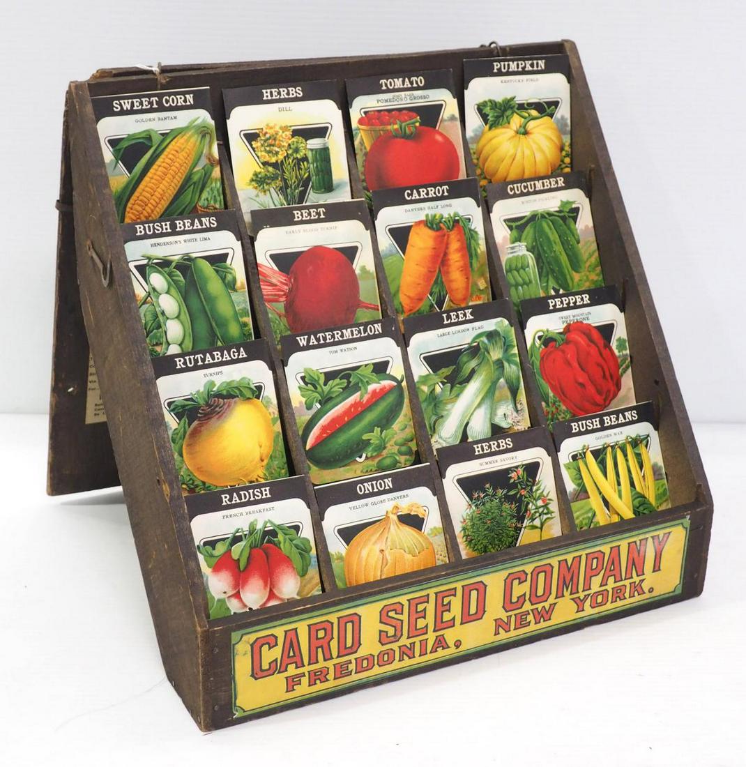 Card Seed Co. wooden display rack: Card Seed Co. wooden display rack with front sign & shipping labels, with 16 original mint Card Seed Co. seed packets, circa 1930, (dimensions when closed 15"x16"x4")