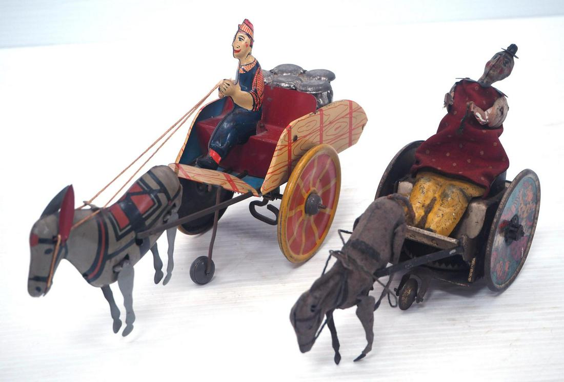 (2) Wind-up Toys: (2) Wind-up toys: Hee Haw donkey with cart -Good, works but touchy / early Lehman donkey with cart & clown -works, Fair, 1 ear missing on donkey