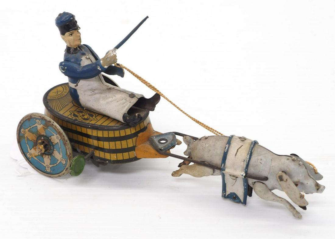 Tin wind-up pig pulling butcher toy (1 of 3)