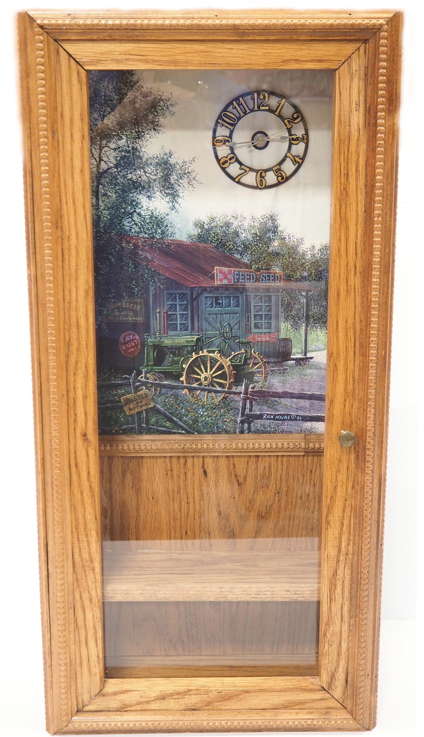 Display case with clock: Display case with clock and shelf inside 13" x 7" x 27"H