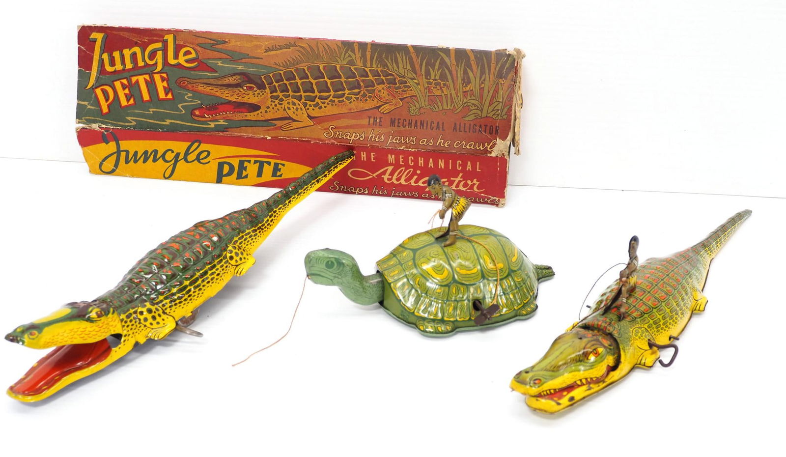 (3) Automatic Toy Co. wind-up toys: (2) Automatic Toy Co. tin wind-up Jungle Pete Alligators and Chein tin wind-up turtle -One with very rough torn box, all good and work