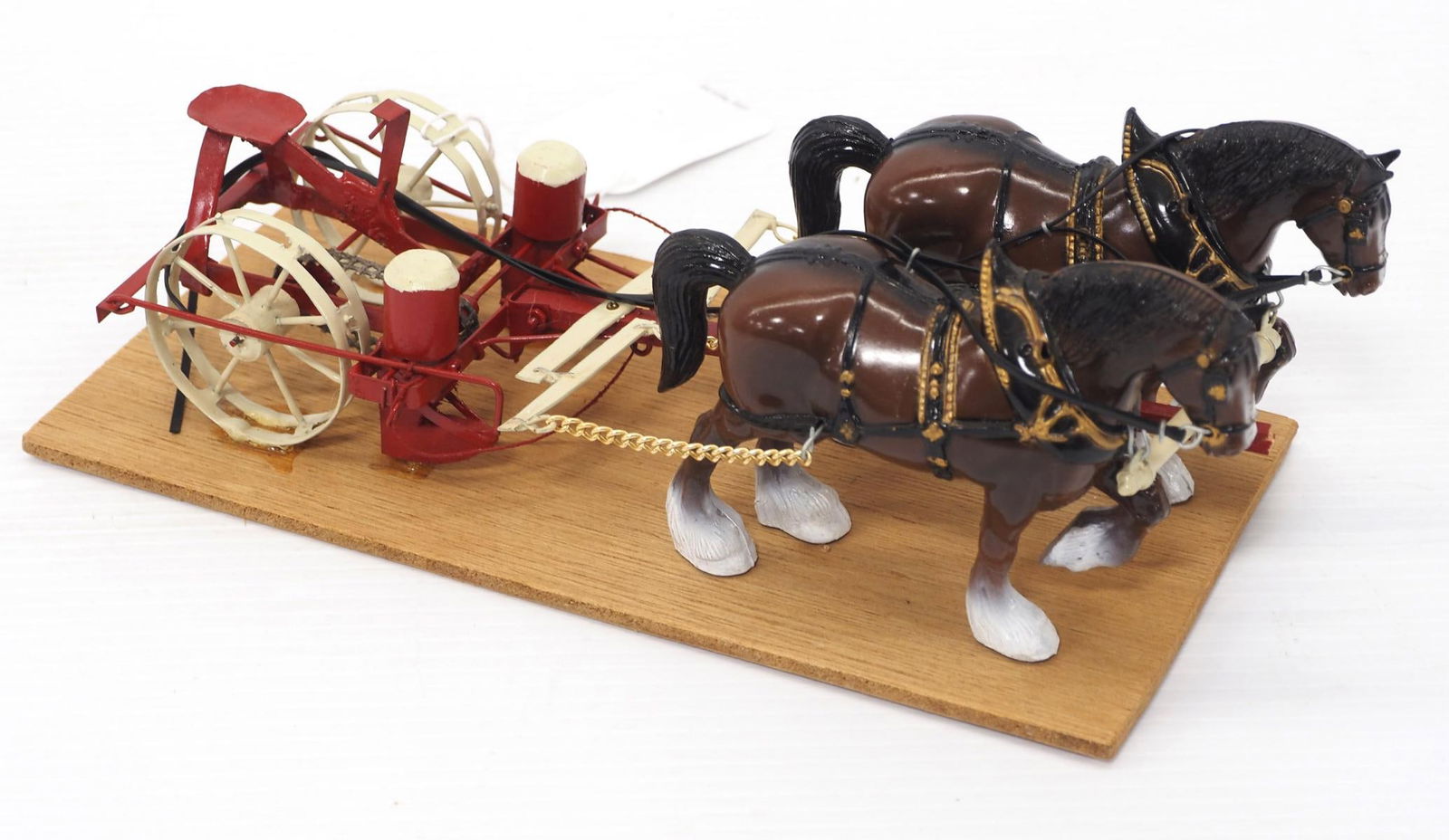 Horse-drawn planter hitched to Clydesdales: 10"L Custom horse-drawn planter hitched to team of plastic Clydesdale horses