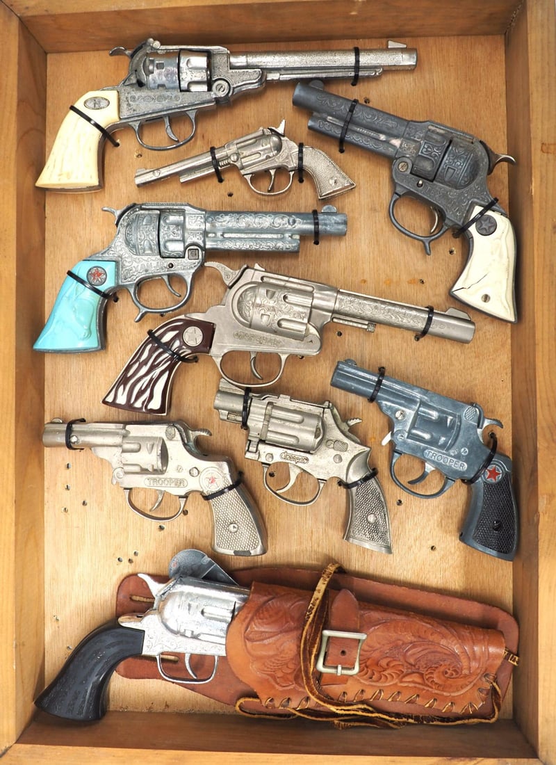 (9) Different cap gun toy pistols: Display case with 9 different cap gun toy pistols