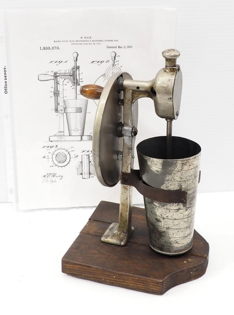 Hand-crank mixing device: M. Black hand-crank mixing device with copy of patent papers