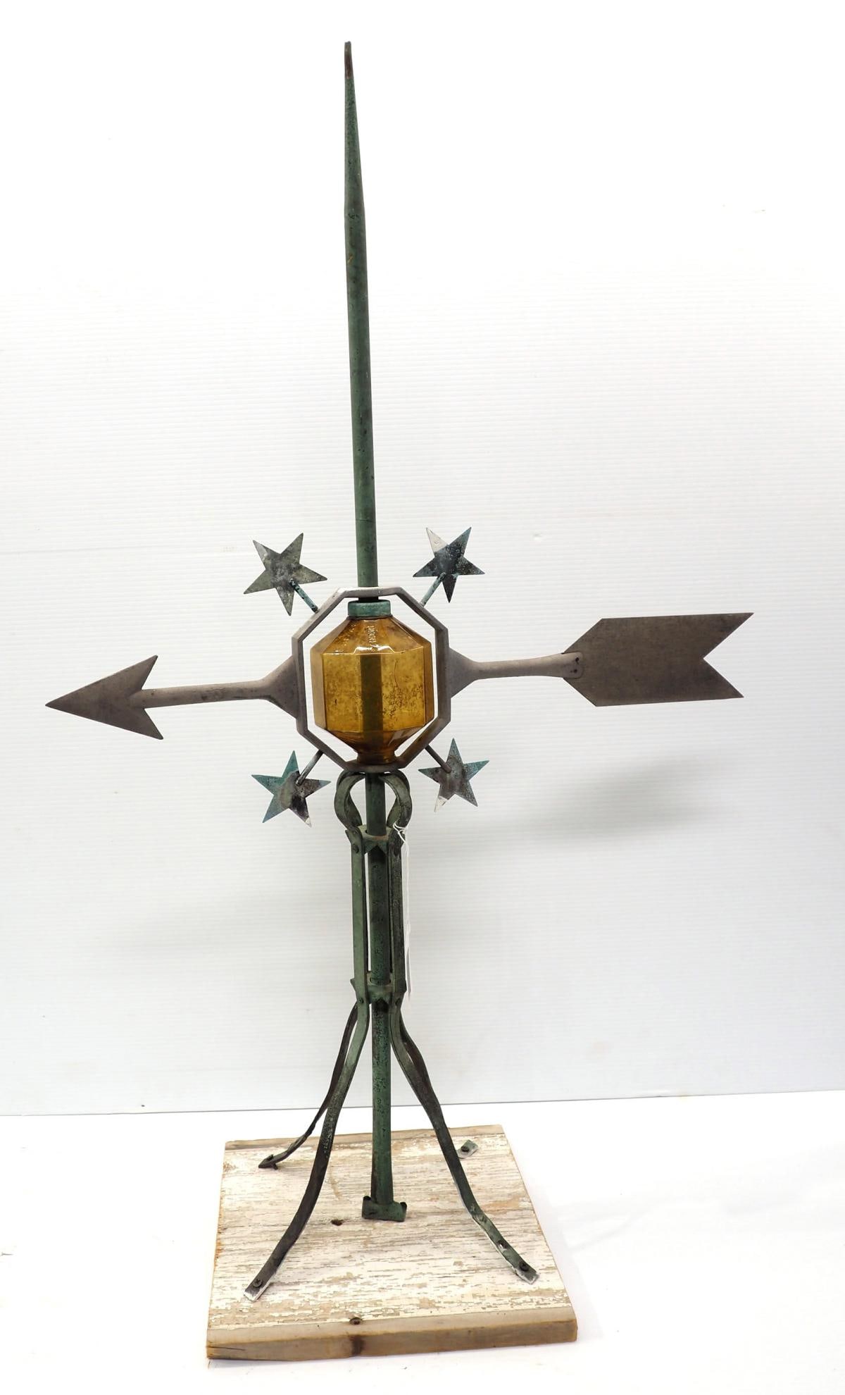 Gold glass ball on brass lighting rod (1 of 4)