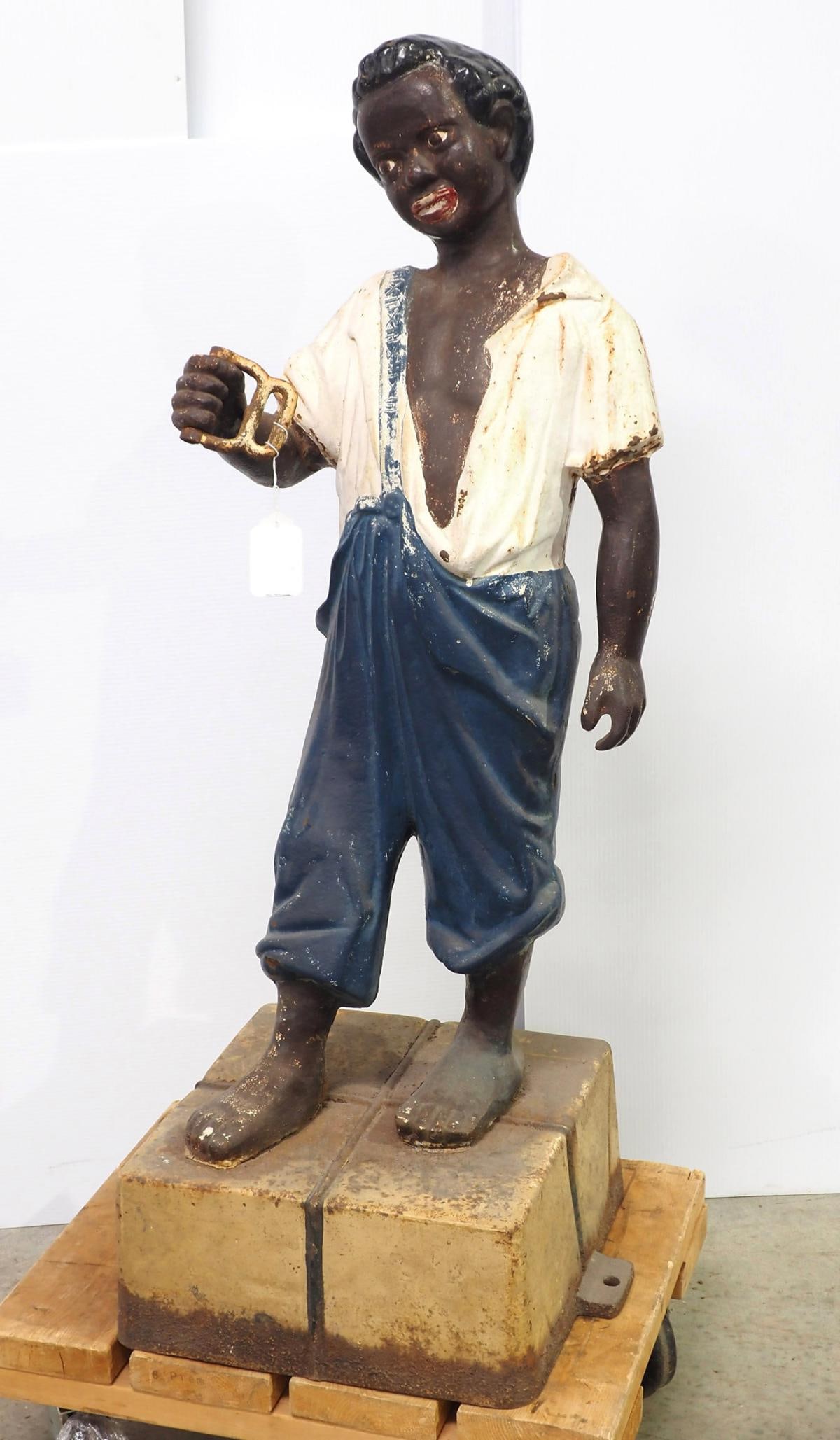 Boy on bale of cotton, cast iron horse tie (1 of 4)