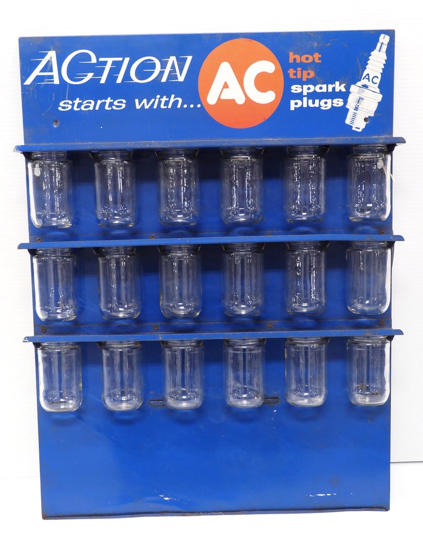 AC Spark Plugs product display sign: 18"x24" SST AC Spark Plugs product display sign with 18 original glass jars - Good * * This lot will be delivered to the UPS Store for professional packing and shipping.