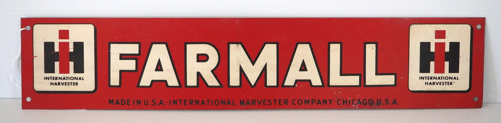 IH Farmall sign: 20"x4" SST IH Farmall sign -Great ***These items are not located at the Chupp Auctions facility and will not be available for preview until April 1. As a result, some questions/info requests will not 
