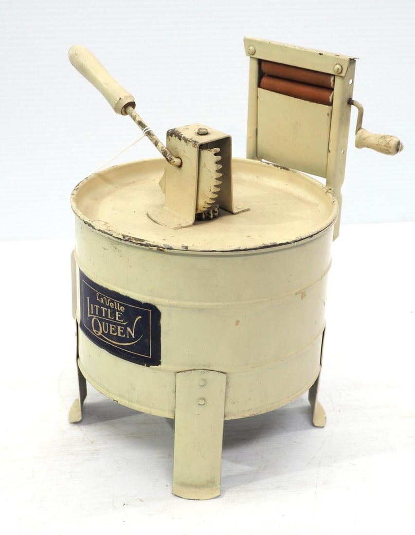 Little Queen toy washing machine: 10"H tin Little Queen toy washing machine -Good ***These items are not located at the Chupp Auctions facility and will not be available for preview until April 1. As a result, some questions/info requ