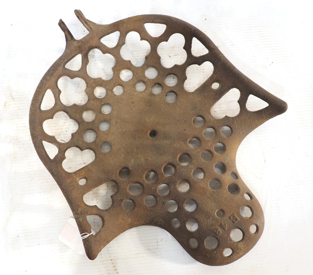 Plain cast iron seat with fancy design: Plain cast iron seat with fancy design ***These items are not located at the Chupp Auctions facility and will not be available for preview until April 1. As a result, some questions/info requests will