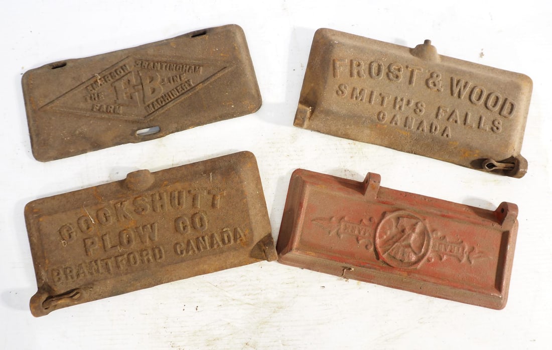(4) Embossed cast iron tool box lids: (4) Embossed cast iron tool box lids: Cockshutt / Frost & Wood / Trademark / The E-B Line ***These items are not located at the Chupp Auctions facility and will not be available for preview until Apri