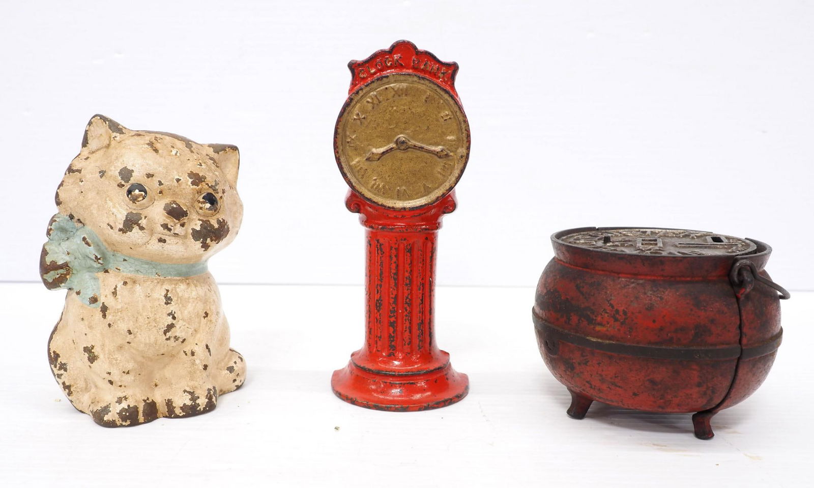 (3) Cast iron banks (1 of 3)