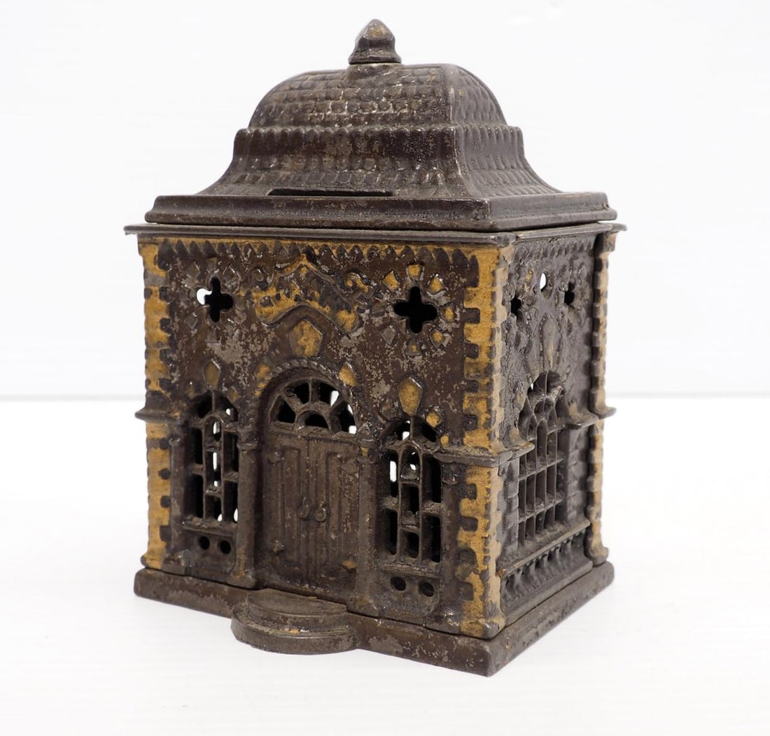 J.E. Stevens 1887 cast iron roof bank: 5.5" tall J.E. Stevens 1887 cast iron roof bank