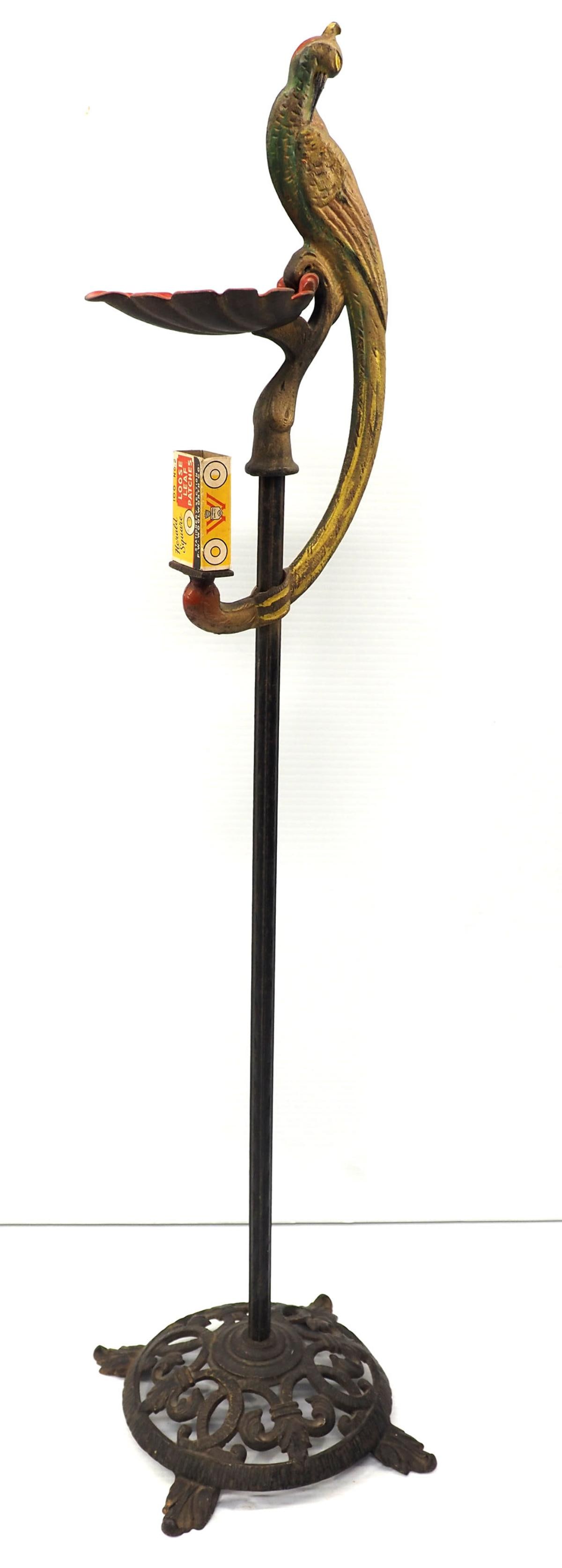 Ash tray with peacock: 32"H ash tray with peacock and cast iron base