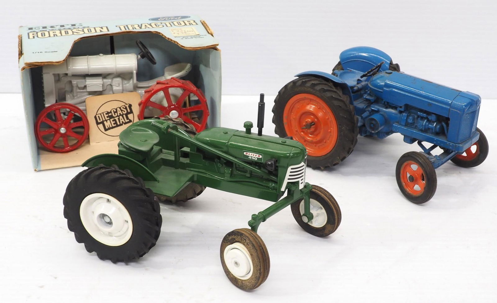 (3) Tractors: (3) 1/16 scale Tractors: Fordson Major -steering rod loose / Ertl Fordson -NIB / Oliver 440 -no steering wheel