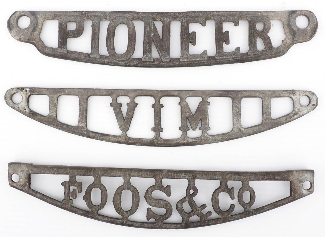 (3) Cast iron cut-out implement tag (1 of 2)