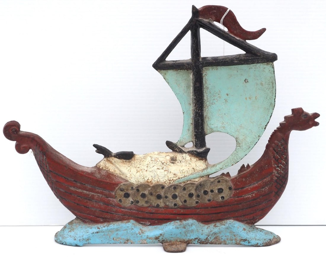 Cast iron ship-shaped door stop: 17"x14"x2"deep cast iron ship-shaped door stop