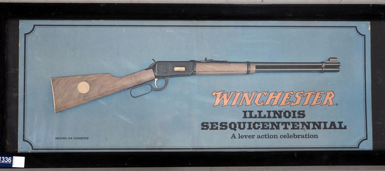 Winchester Illinois Sesquincentennial poster: 34"x13" cardboard Winchester Illinois Sesquincentennial poster depicting a Model 94 Carbine rifle - Very Good with pin holes in corners and some fading