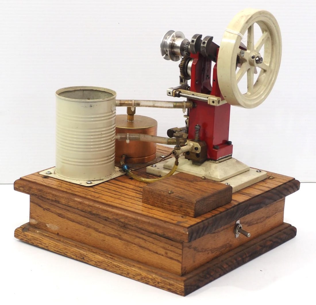 Model gas hit & miss engine: Model gas hit & miss engine, 12"x11"x13"H with wood base, 5.25" wheel dia - untested