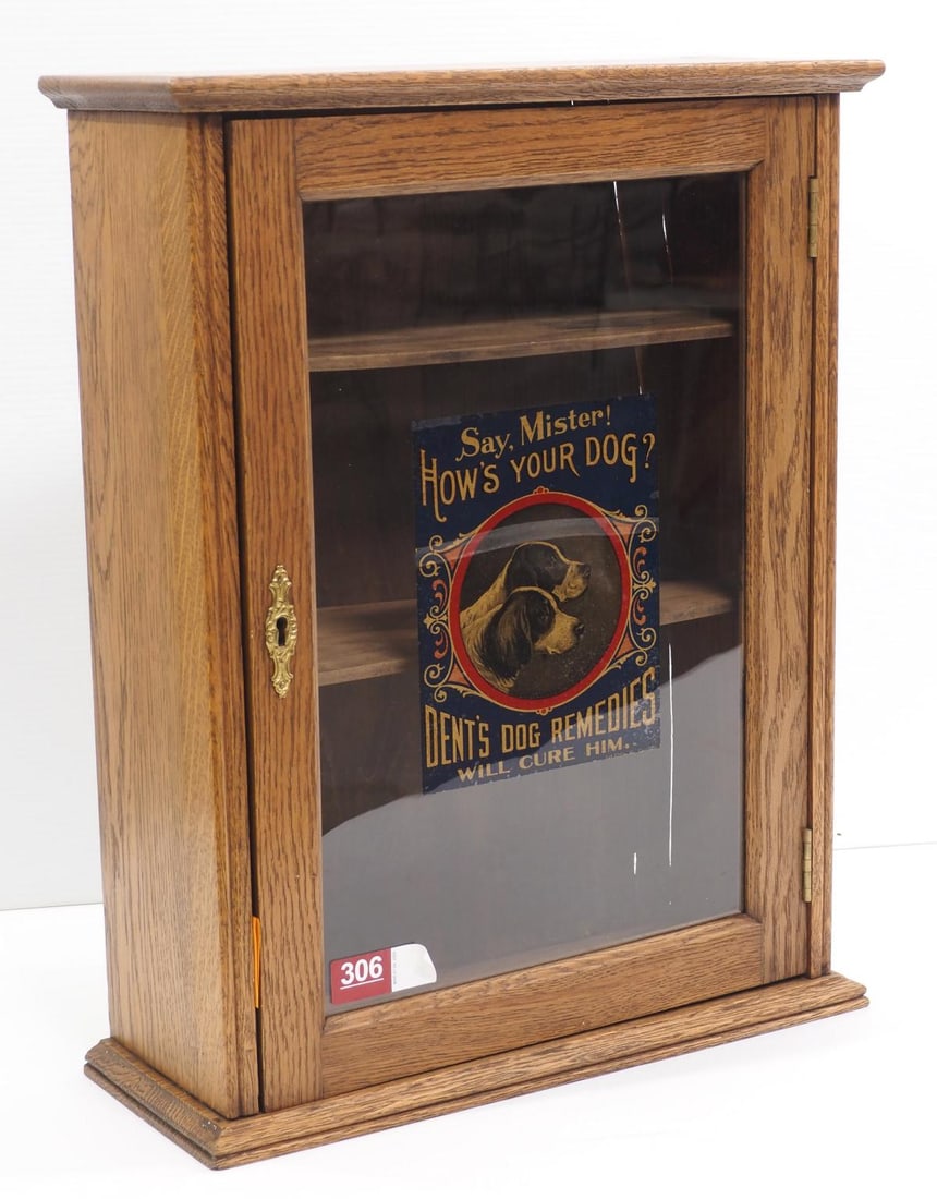 Wooden vet cabinet for Dent's Dog Remedies: Wooden veterinary cabinet for Dent's Dog Remedies with advertisement on glass door and stenciling "Property of Dent Veterinary Prod" on back, 18"x7"x22.5"H * * This lot will be delivered to the UPS St