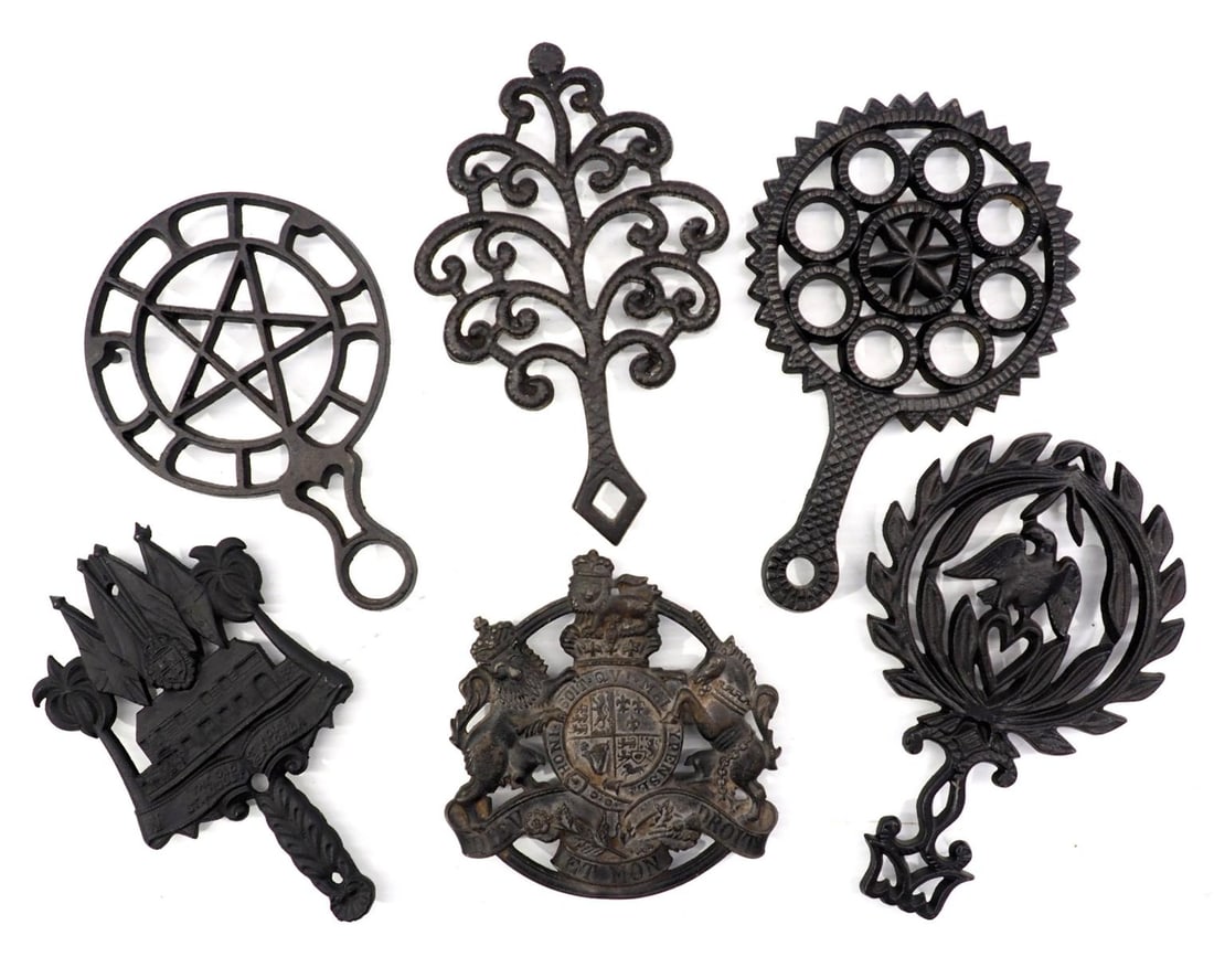 (6) Trivets: (6) Trivets including (3) Griswolds, marked No's 1730, 1727, 1726, and 1740 (1) Kings Arms, and (1) from Spain