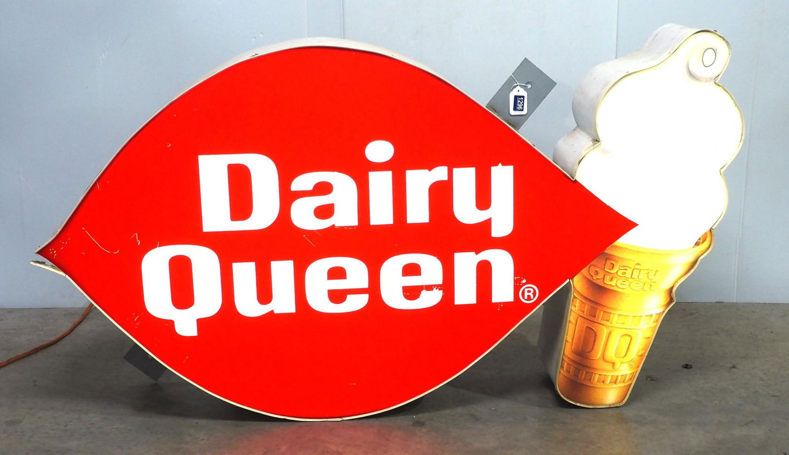 Dairy Queen lighted sign: 62"x36"H plastic Dairy Queen lighted sign with ice cream cone - Good, needs cleaned, some edges need repaired, works! * * We WILL NOT SHIP this item, you must arrange to have this picked up in 15 days