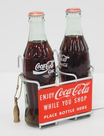 Grocery cart Coca Cola bottle holder