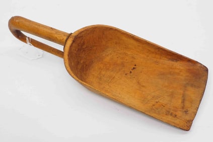 Scoop carved from single piece of wood