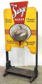 Surge Milker store display stand with milker
