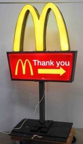 McDonalds drive-thru sign on stand