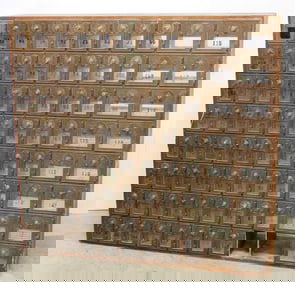 Wall of post office mail boxes with brass doors