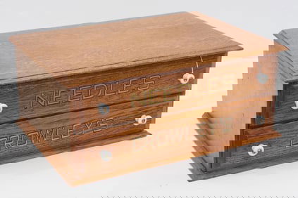 Oak 2-drawer Crowleys Needles cabinet