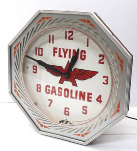 Flying A Gasoline neon clock: 18"dia. Flying A Gasoline neon clock with glass face and metal frame - Excellent, works! * * This lot will be delivered to the UPS Store for professional packing and shipping.