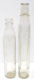 (2) 1-quart tall glass oil bottles with labels