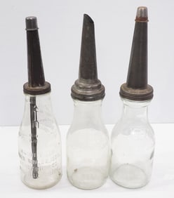 (3) 1-quart glass oil bottles with metal spouts