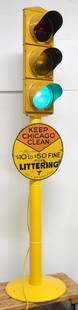 Electrified traffic light on painted stand: Electrified traffic light on painted stand with 18"dia. SST Chicago Littering sign, on cast iron base, 88"H overall - works * * White Glove transportation available, contact auction house for quote.