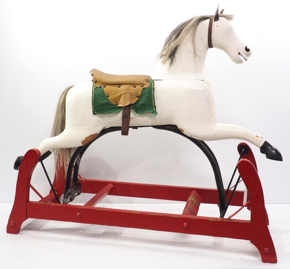 Early wooden rocking horse with horse hair mane & tail, 44"L x 37"H: Early wooden rocking horse with horse hair mane & tail, 44"L x 37"H - cracks in wood, missing eyes * * White Glove transportation services available, please contact the auction house for a quote.