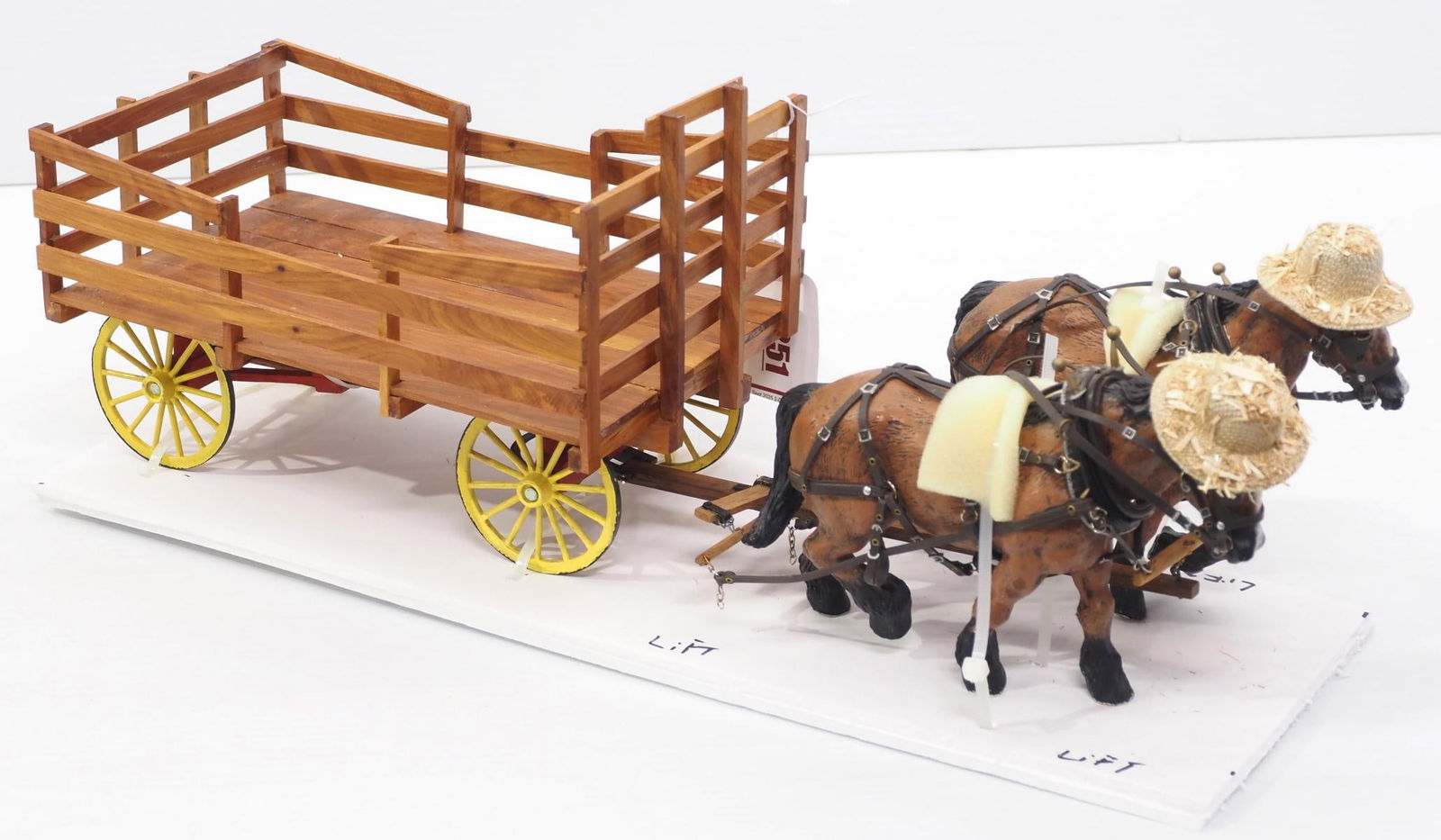 Custom wooden hay wagon hitched to 2 Foxfire horses with straw hats, overall 21"L: Custom wooden hay wagon hitched to 2 Foxfire horses with straw hats, overall 21"L * * This lot will be delivered to the UPS Store for professional packing and shipping.