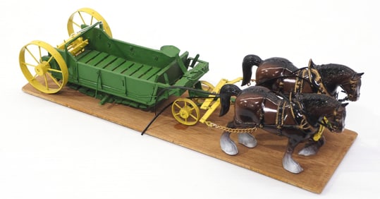 Team of plastic horses hitched to custom wooden John Deere manure spreader, 15"L overall