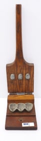 Face-shaped candy mold with brass tag for Thos. Mills & Bro. Confectioners & Bakers Tools