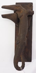 Cast iron, alligator-shaped Blake's Nut Cracker with partial label on base for Blake Brothers
