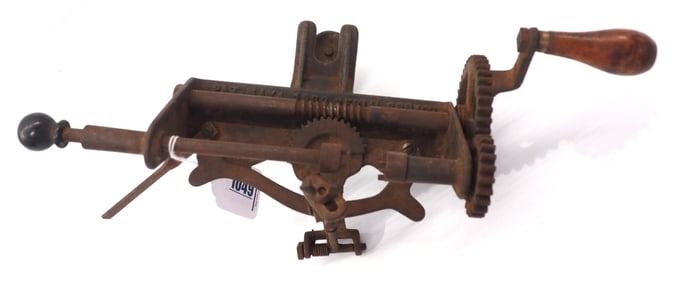 Unusual cast iron orange parer machine patent filed May 4, 1933 by Douglas E. China for Sunshine