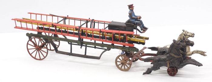Cast iron horse-drawn ladder wagon with 3 ladders & driver, 24"L overall