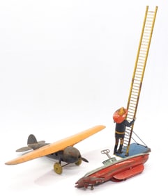 (3) Tin toys: fireman climbing ladder / airplane with 18" wingspan / wind-up submarine with key,