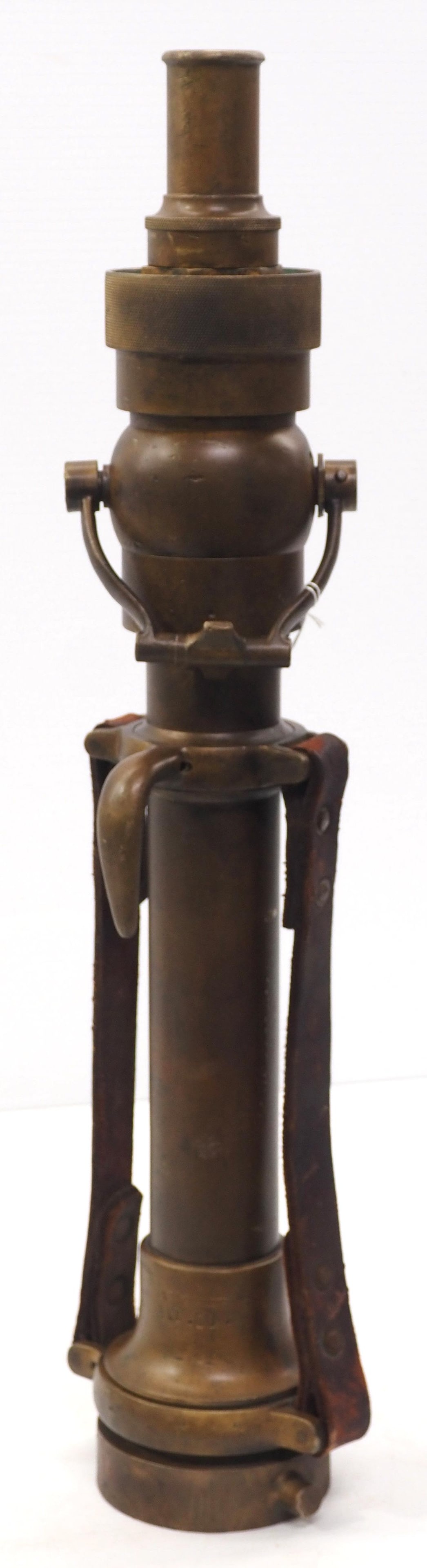 Brass fire nozzle with leather handles, by the The Eastern Coupling Co., Camden, ME, marked A.T. Co. (1 of 3)