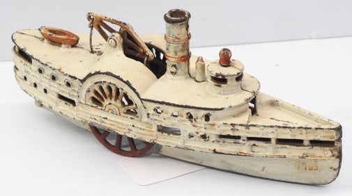 Early cast iron steamboat toy with original paint, 10.5"L