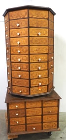80-drawer wooden, rotating cabinet sitting on 24-drawer matching base, many drawers FULL of assorted