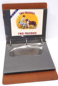 Binder filled with colorful paper advertising for cigar and tobacco companies including Little