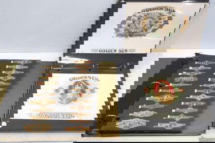 Binder filled with colorful paper advertising for cigar and tobacco companies including Golden Sun,
